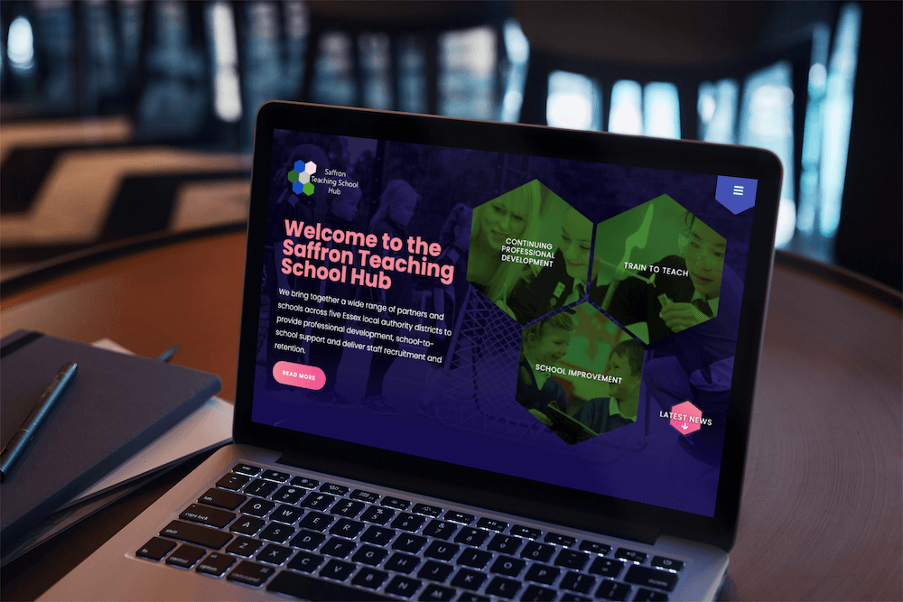 Homepage hexagons on a macbook, dark background